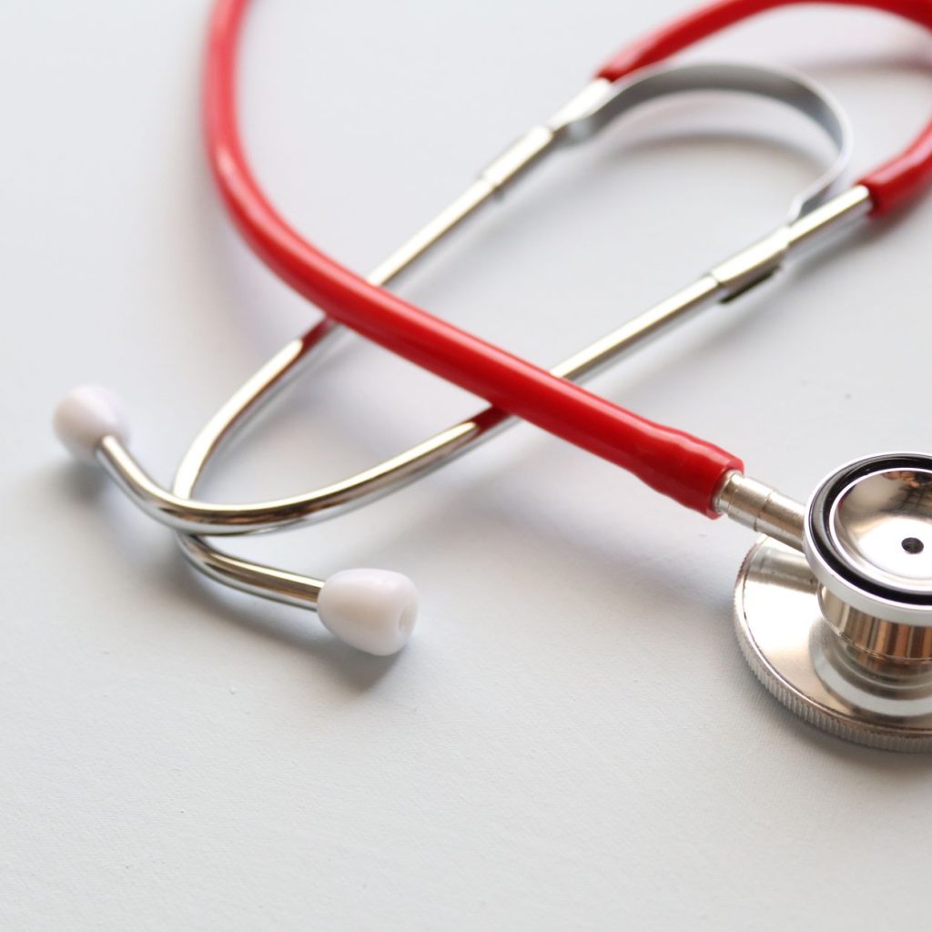 Close-up of a red stethoscope symbolizing medical care and healthcare diagnostics. — About The Different Types Of Anthem Insu