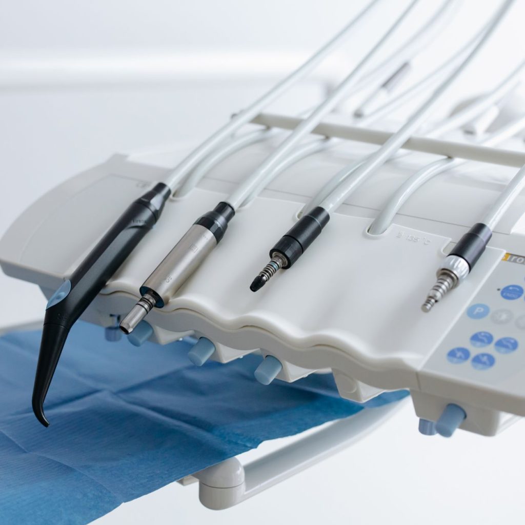Close-up of dental equipment with handpieces, showcasing modern dental care tools in a clinic. — Dental Implant Guide