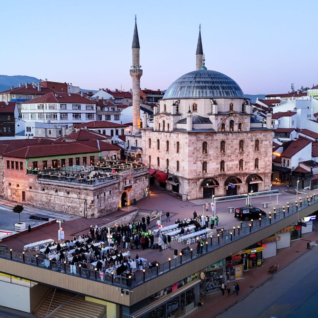 Aerial shot of Bolu city with a prominent mosque and bustling streets during twilight. — Innovation in Health: Paving the Way