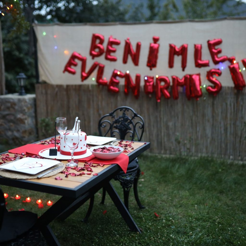 Outdoor romantic dinner setup in Sapanca, Türkiye with proposal decorations. — Make a Difference: Teaching English with TEFL