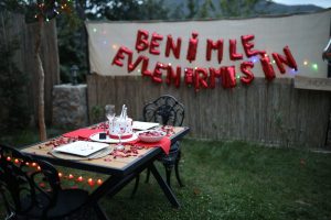 Outdoor romantic dinner setup in Sapanca, Türkiye with proposal decorations. — Make a Difference: Teaching English with TEFL