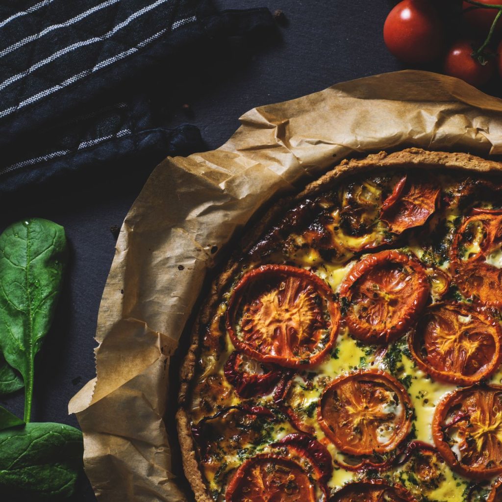 Delicious rustic quiche topped with tomatoes, ideal for a healthy and tasty meal. — Microwaved Foods - Healthy or Harmful?