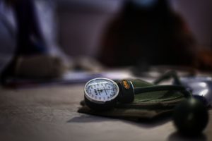 Detailed image of a medical sphygmomanometer on a table, indicating health check-up setting. — Pain Relieve Foods: Must Add T