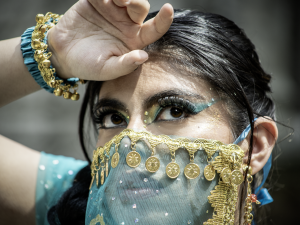Close-up of an elegantly adorned woman in traditional attire with gold details. — Top 4 Reasons Consumers Are Turning to Natu