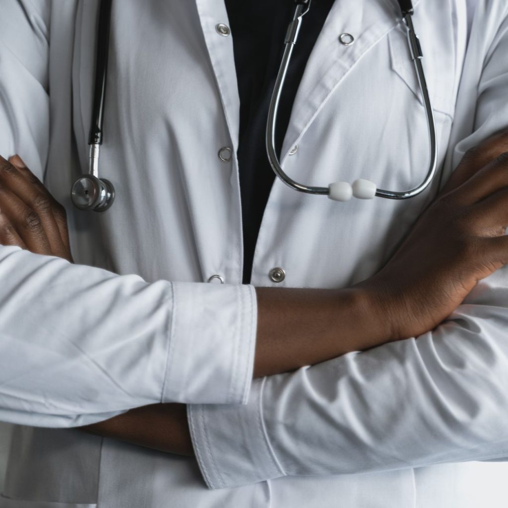 Close-up of a confident doctor in a lab coat standing with crossed arms and stethoscope. — What is the best treatment for lic