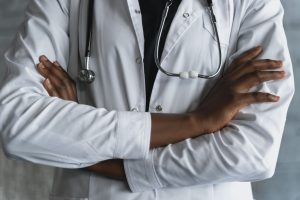 Close-up of a confident doctor in a lab coat standing with crossed arms and stethoscope. — What is the best treatment for lic