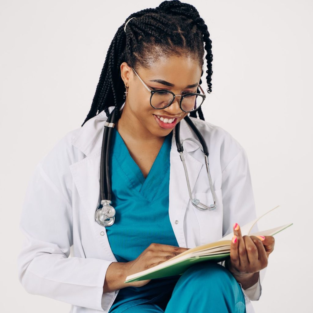 Smiling female doctor with stethoscope reading medical documents. — Why Nutritional Products are So High in Demand?